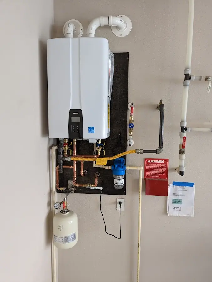 Professional plumber installing copper piping in a Umatilla home